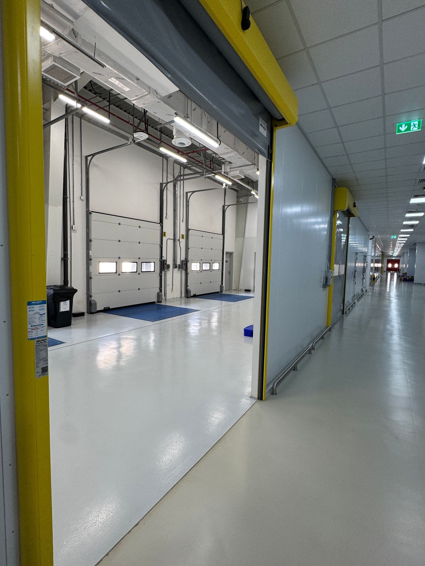 Clean insulated receiving bays and corridor photographed during a facility visit; not a Nord Hub facility
